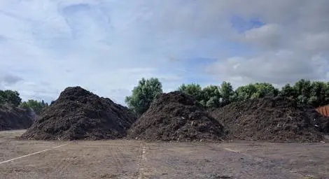 Three large piles of mud